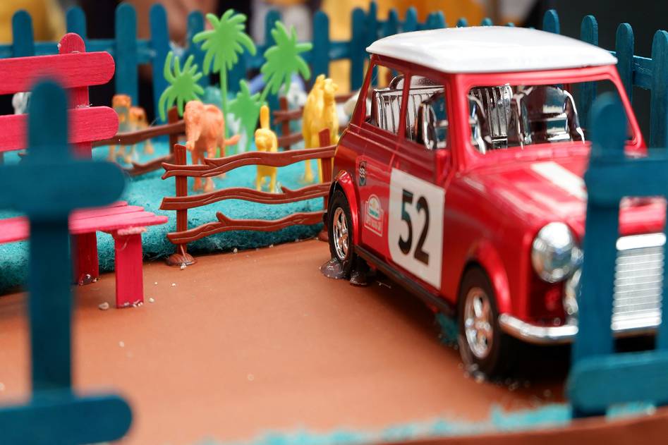 Close-up of an RC car racing on a dirt track with motion blur and dynamic lighting